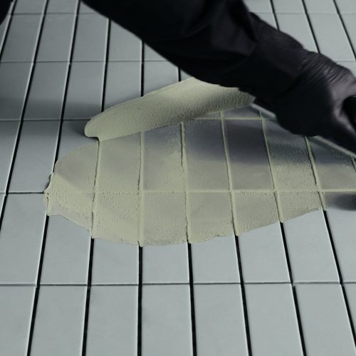 Fugalite Color resin grout being applied