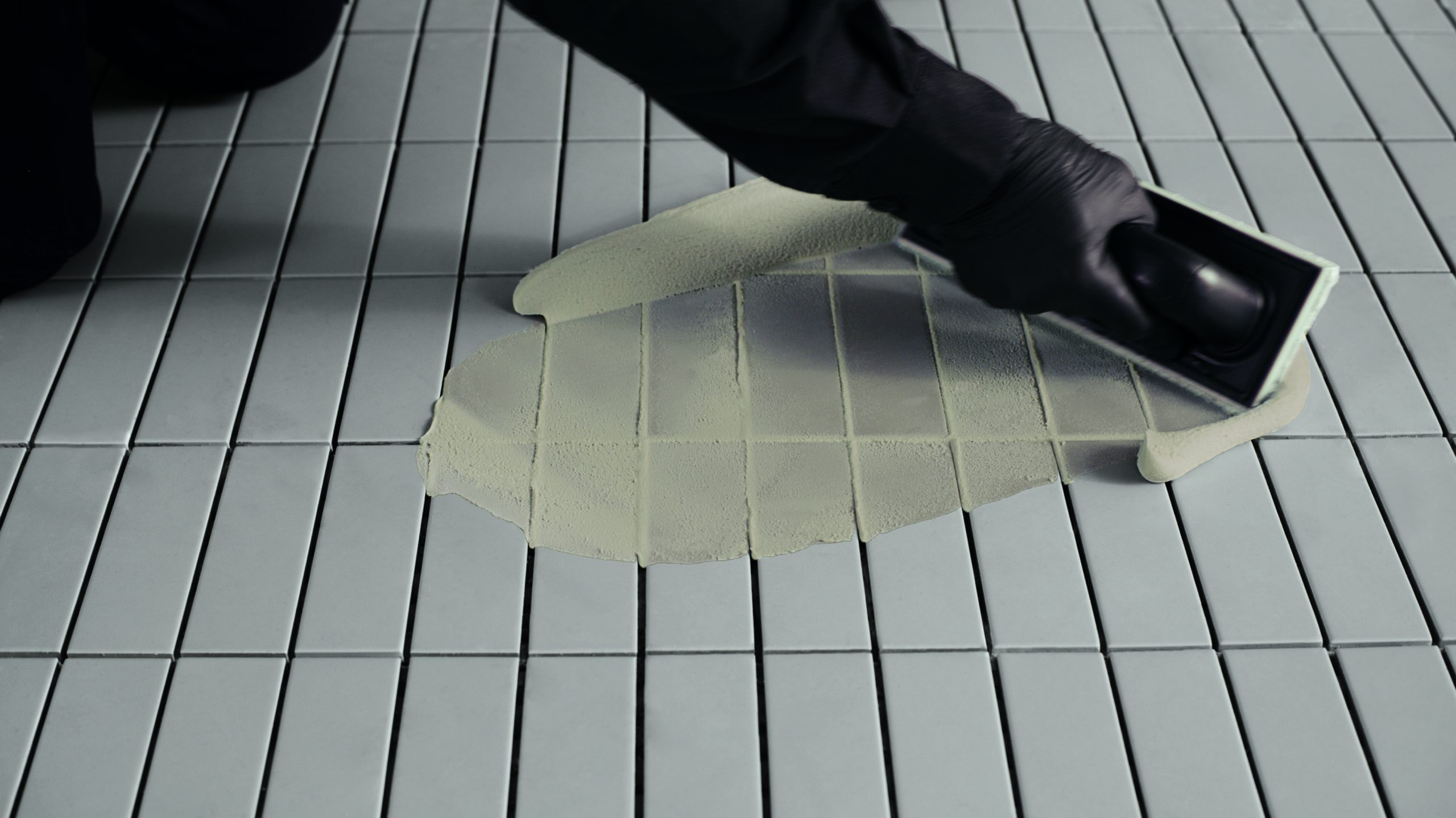 Fugalite Color resin grout being applied